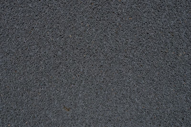 deatiled view of a gray synthetic doormat